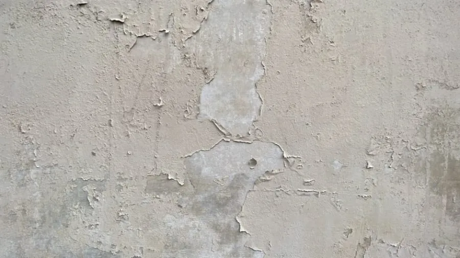 A worn, faded old driveway surface