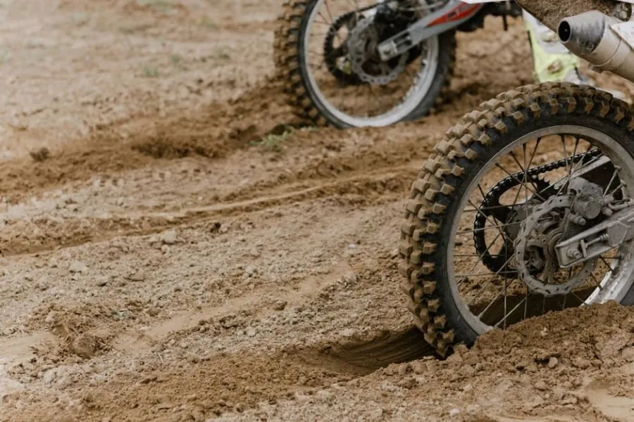 Tyre ruts worn into a gravel driveway