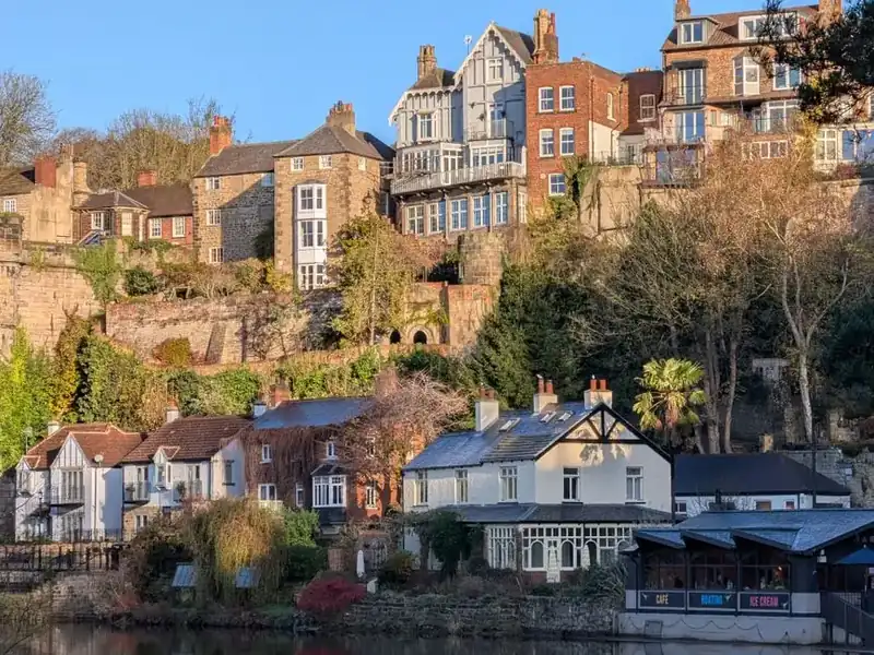 Stone terraced houses stepping up a hillside, typical of the Littleborough area