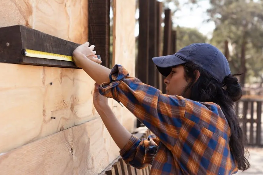 A tape measure being used to check dimensions on an outdoor project