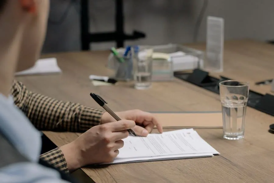 Reading through a written driveway specification before signing