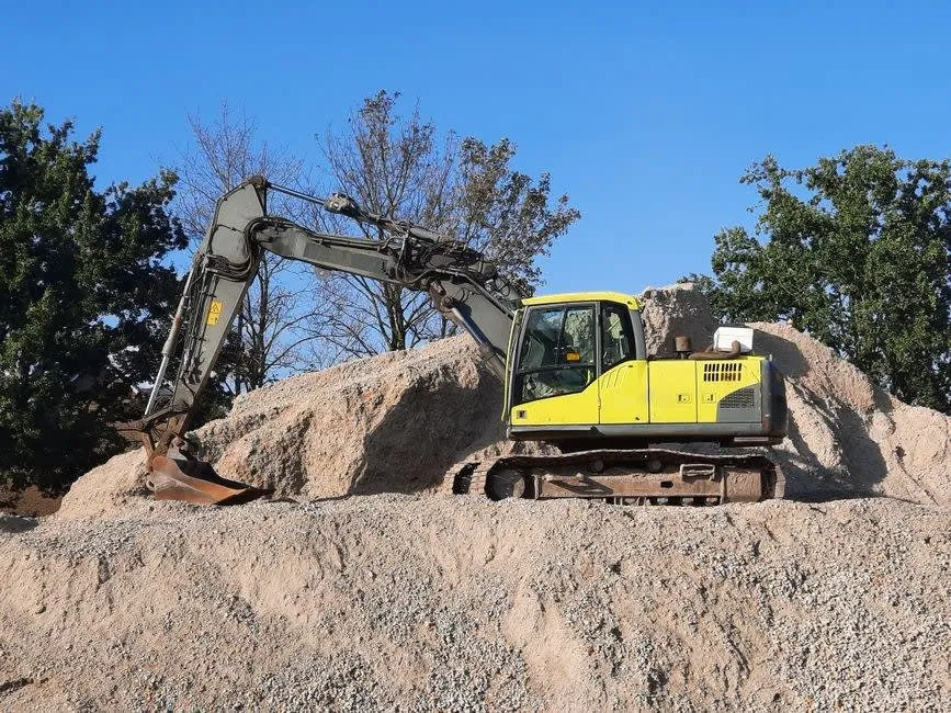 Excavation and stone being worked on site, the sub-base stage that decides how long a rental driveway lasts