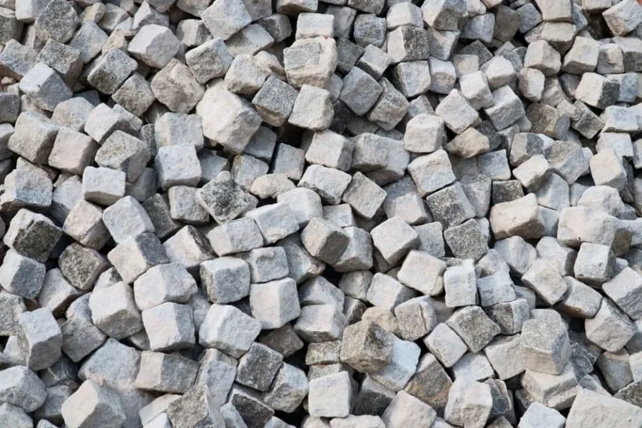 A block paving driveway alongside a resin surface