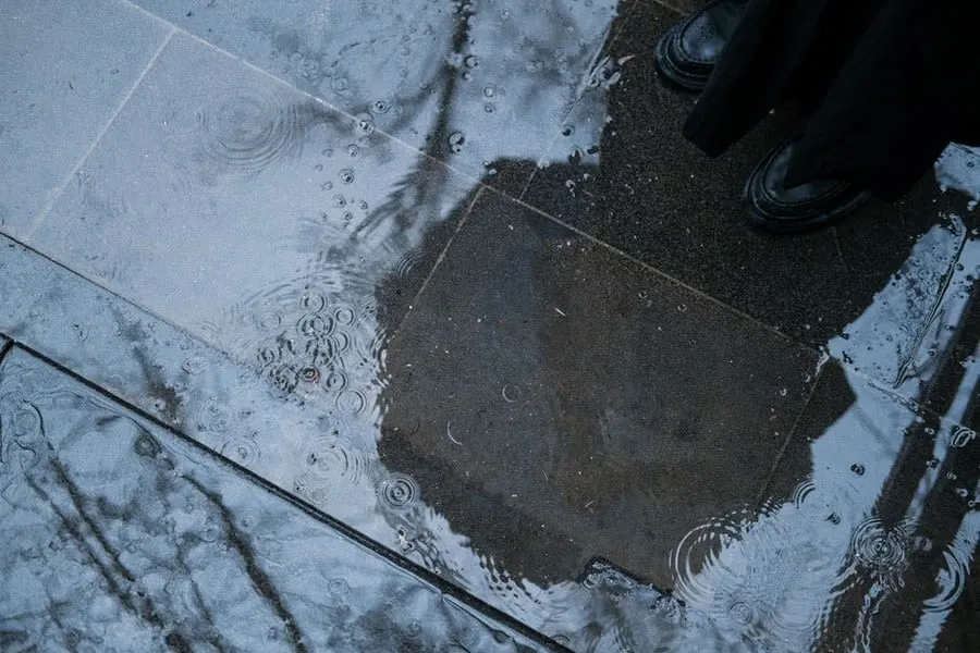Rainwater standing in puddles on a hard surface, what happens when a permeable driveway is sealed over