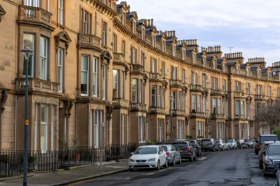 Cars parked along a terraced street