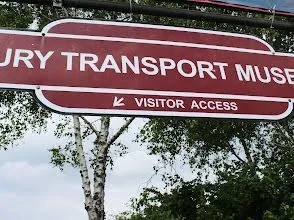 A red and white sign for the jury transport museum