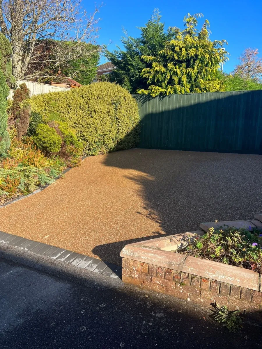 Resin driveway with diamond shapes middle.