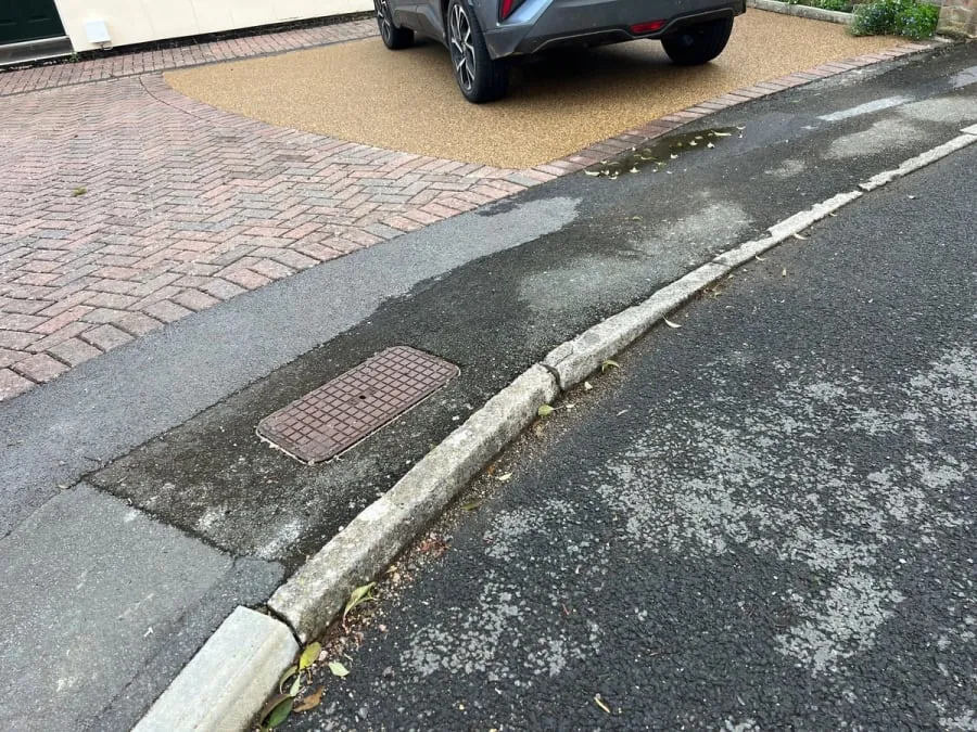 The number 8 in gold worked into a red resin driveway.