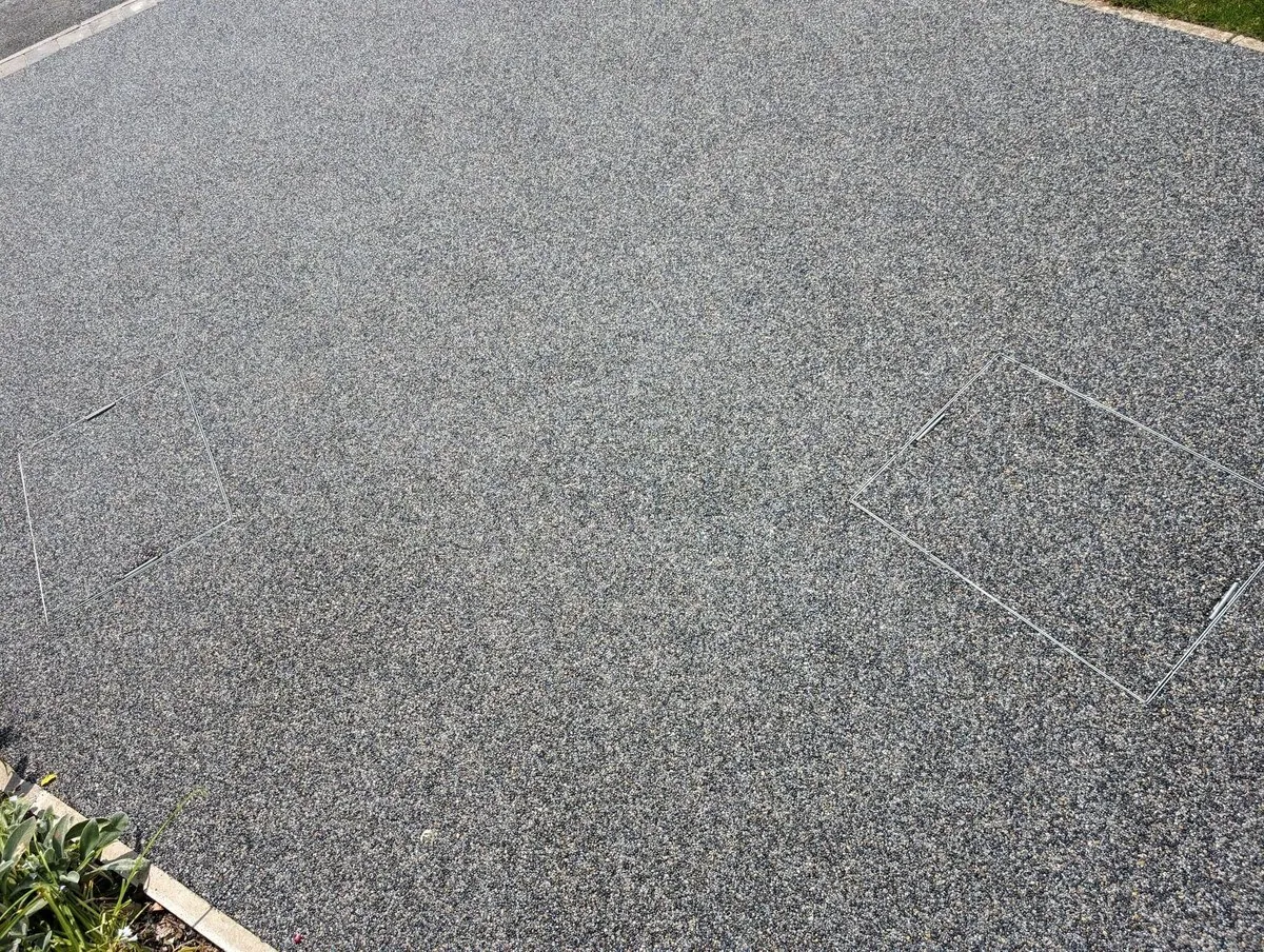 A resin bound driveway being laid at a property in Rochdale