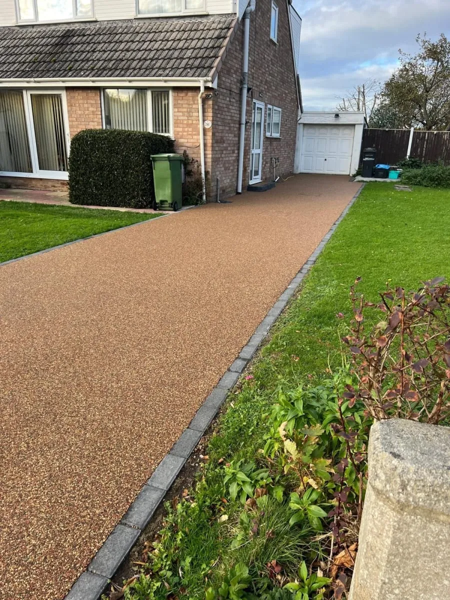 A gravel driveway patio  in front of a house in Rochdale. 